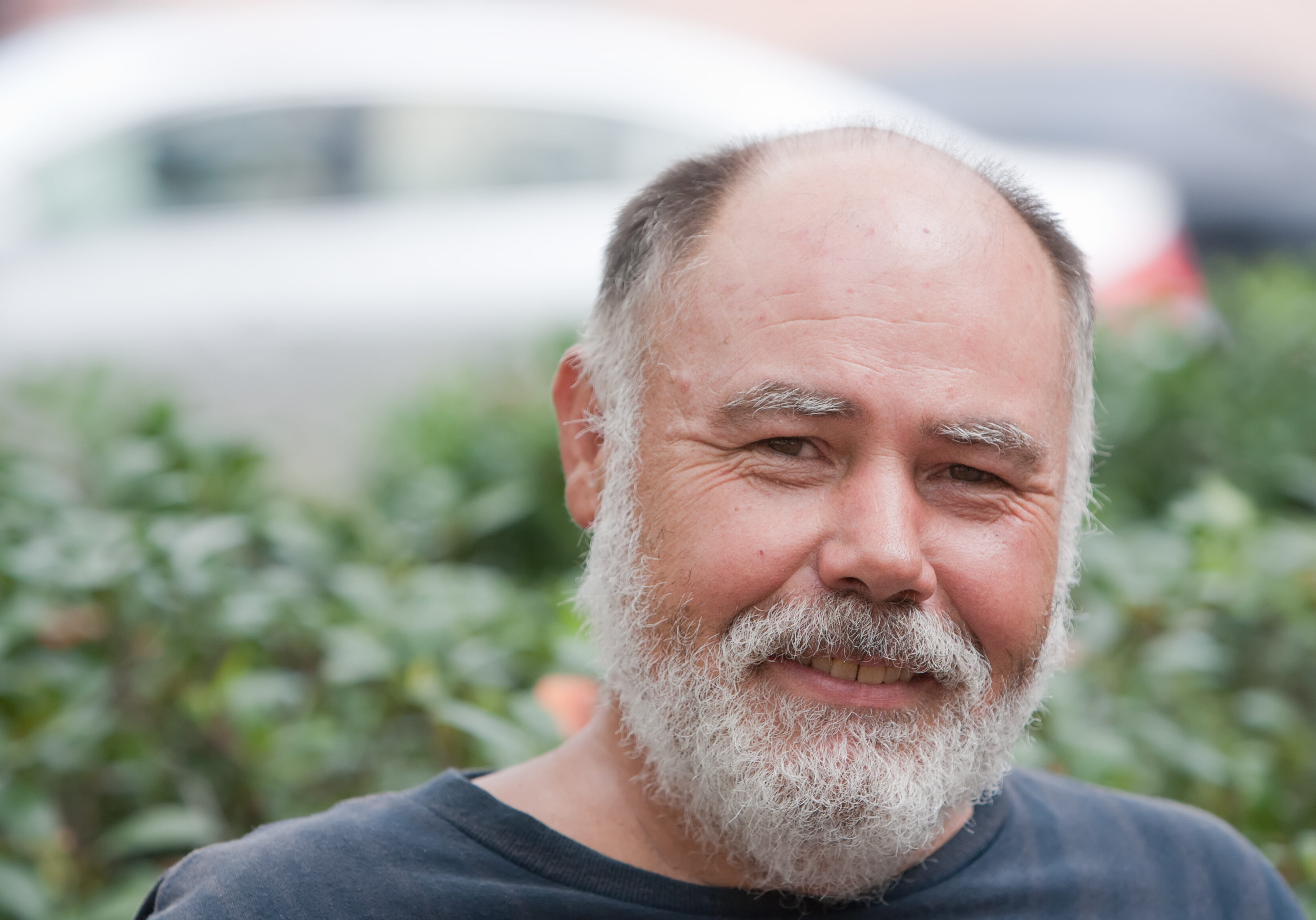 Happy balding man outdoors during the day